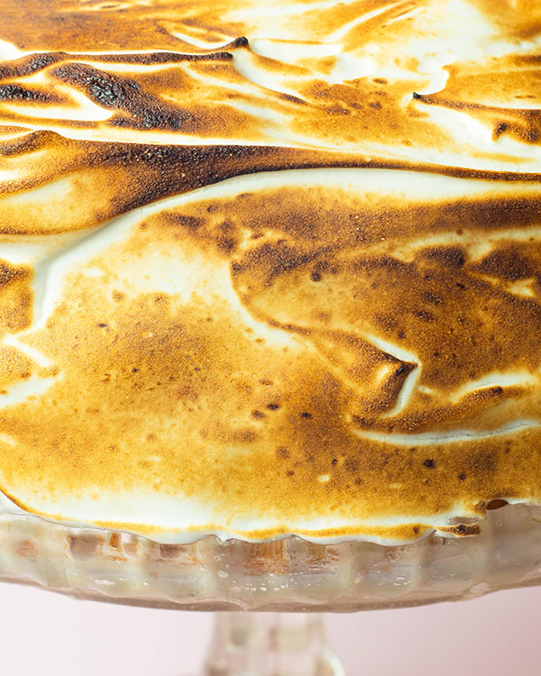 A close up of the burnt meringue coating the tres leches cake.