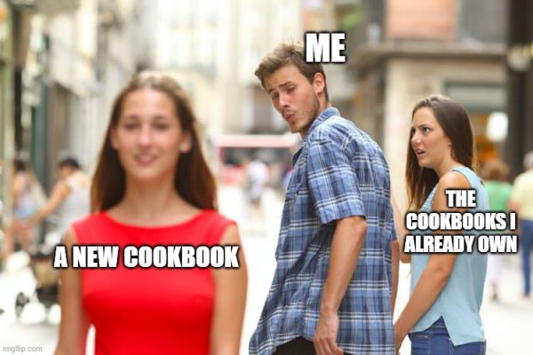 A guy with ME written above his head, looking at a girl with "A NEW COOKBOOK" written across her and then his angry girlfriend with "THE BOOKS I ALREADY OWN" written across her
