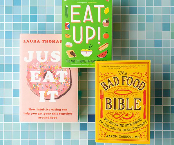 A stack of the books Just Eat it by Laura Thomas Phd, Eat up! by Ruby Tandoh and The Bad Food Bible by Aaron M. Carroll